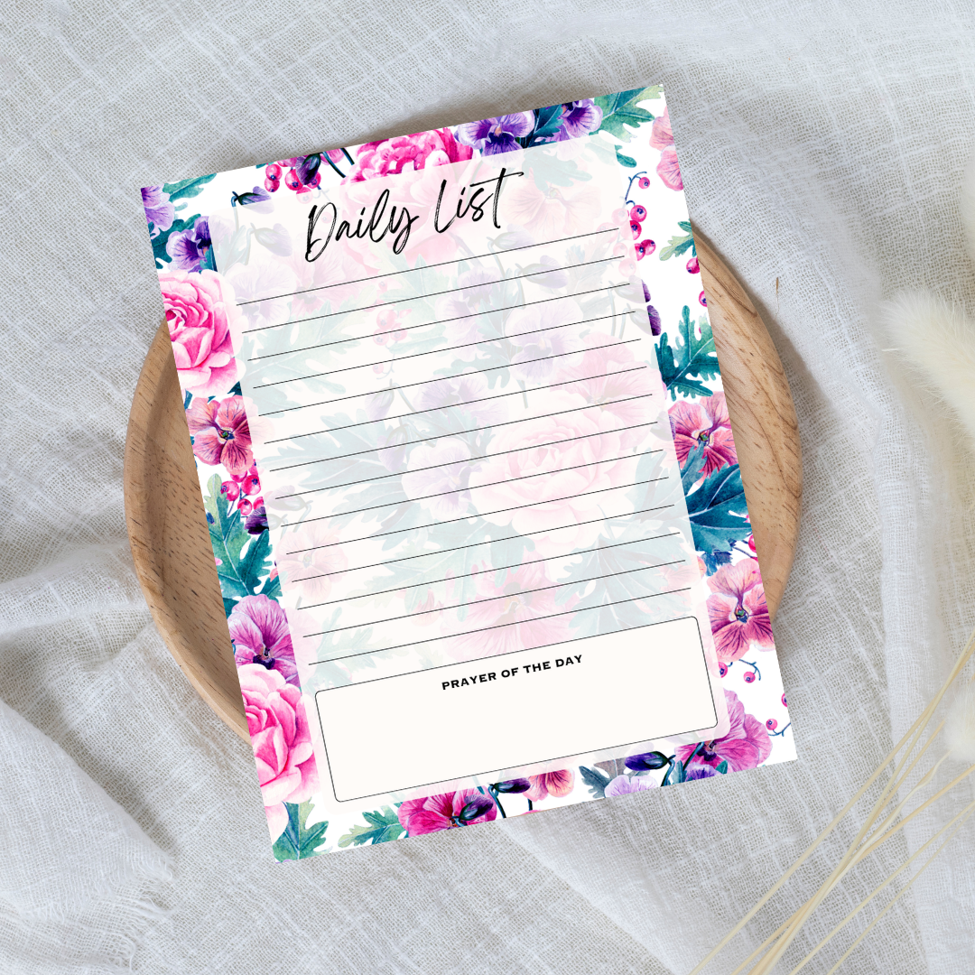 Floral daily list notepad on a textured surface