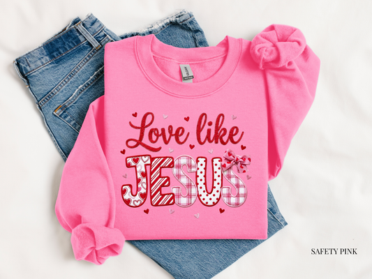love like Jesus sweatshirt against blue jeans and white background