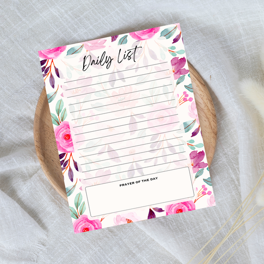 Floral daily list notepad on a textured surface