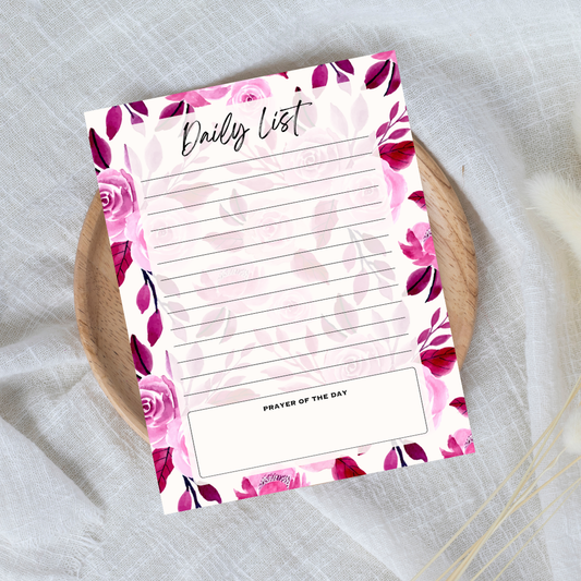 Floral daily list notepad on a textured surface