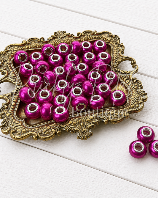 bead on gold tray against white background