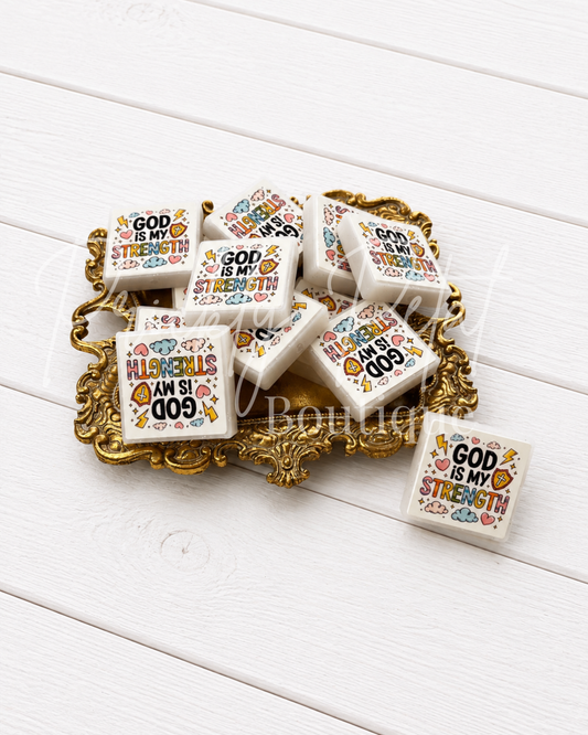 God is my strength silicone focal bead on gold tray against white background