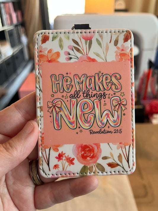 Floral-patterned cardholder with text held by a hand