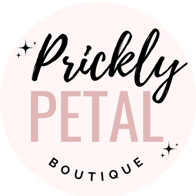 Logo of Prickly Petal Boutique with a pink and black design on a white background