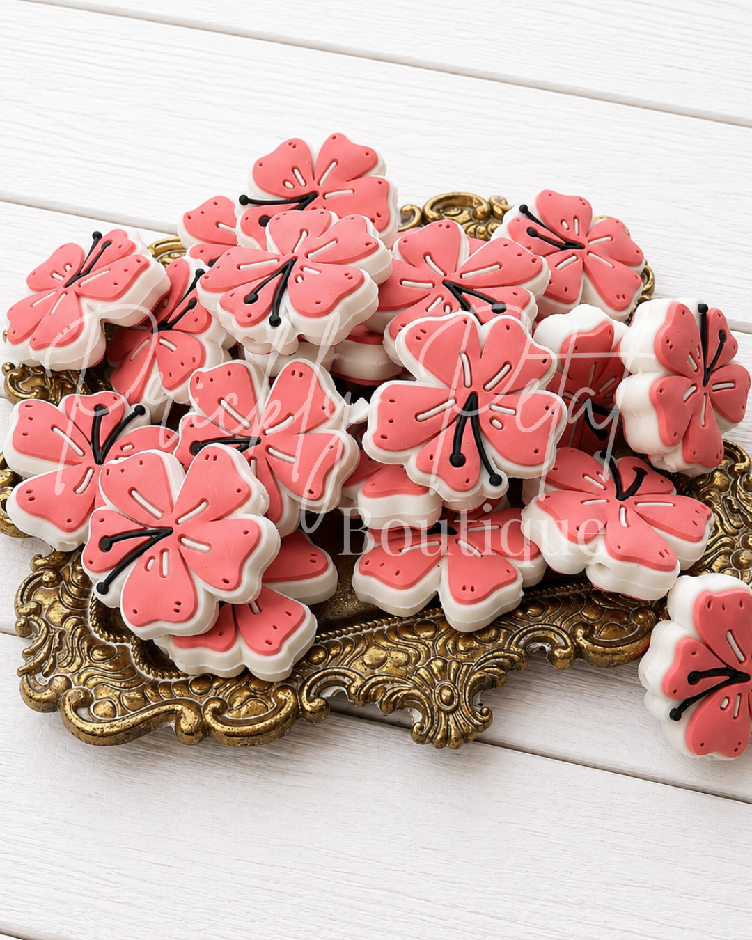 flower bead on gold tray against white background