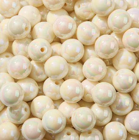 Beige pearl beads with a slight iridescent sheen.